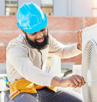 Man, technician or screwdriver for air conditioner on rooftop in the city for box or ac repair labo